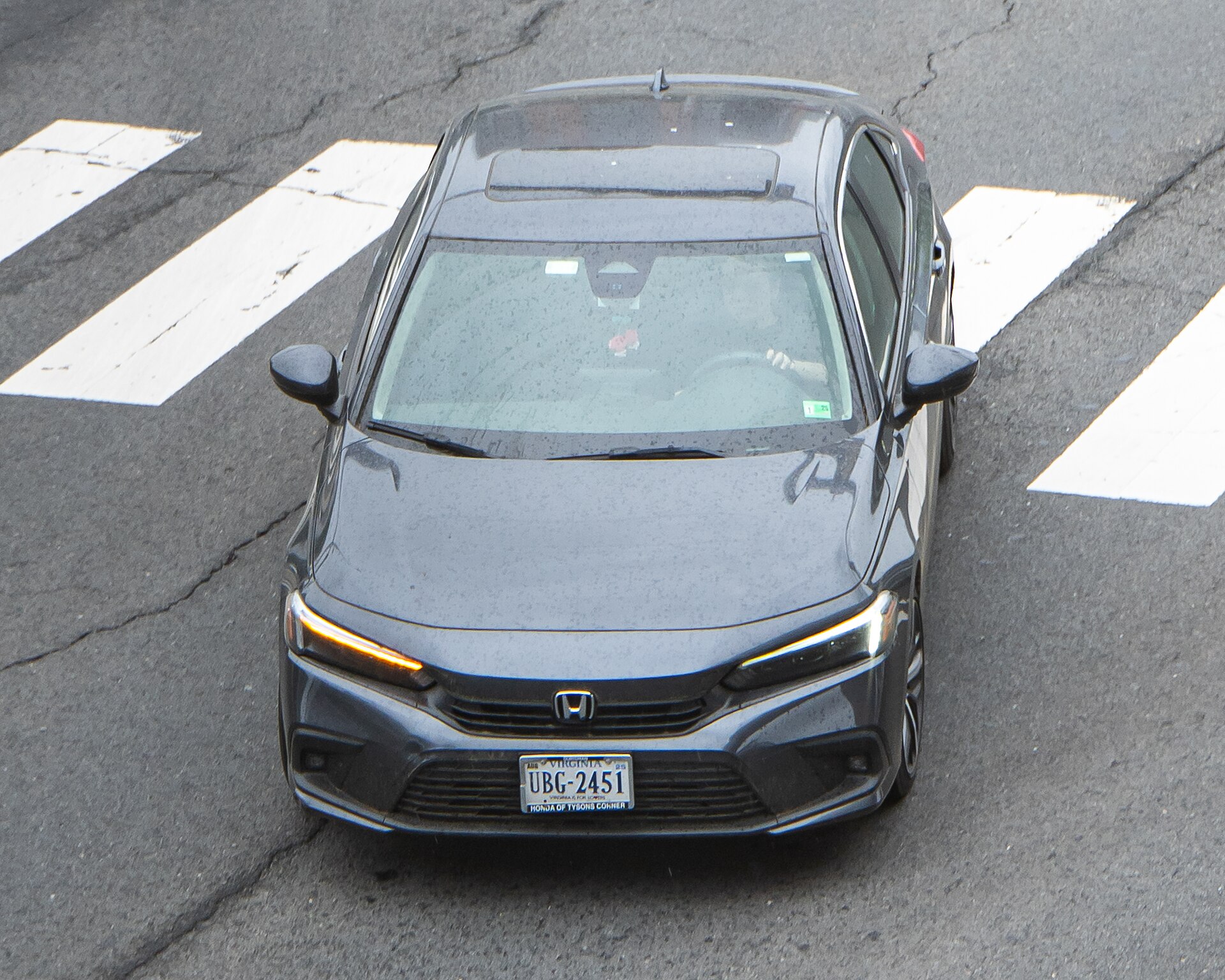 Official 2026 Honda Civic sedan in a front three-quarter exterior view