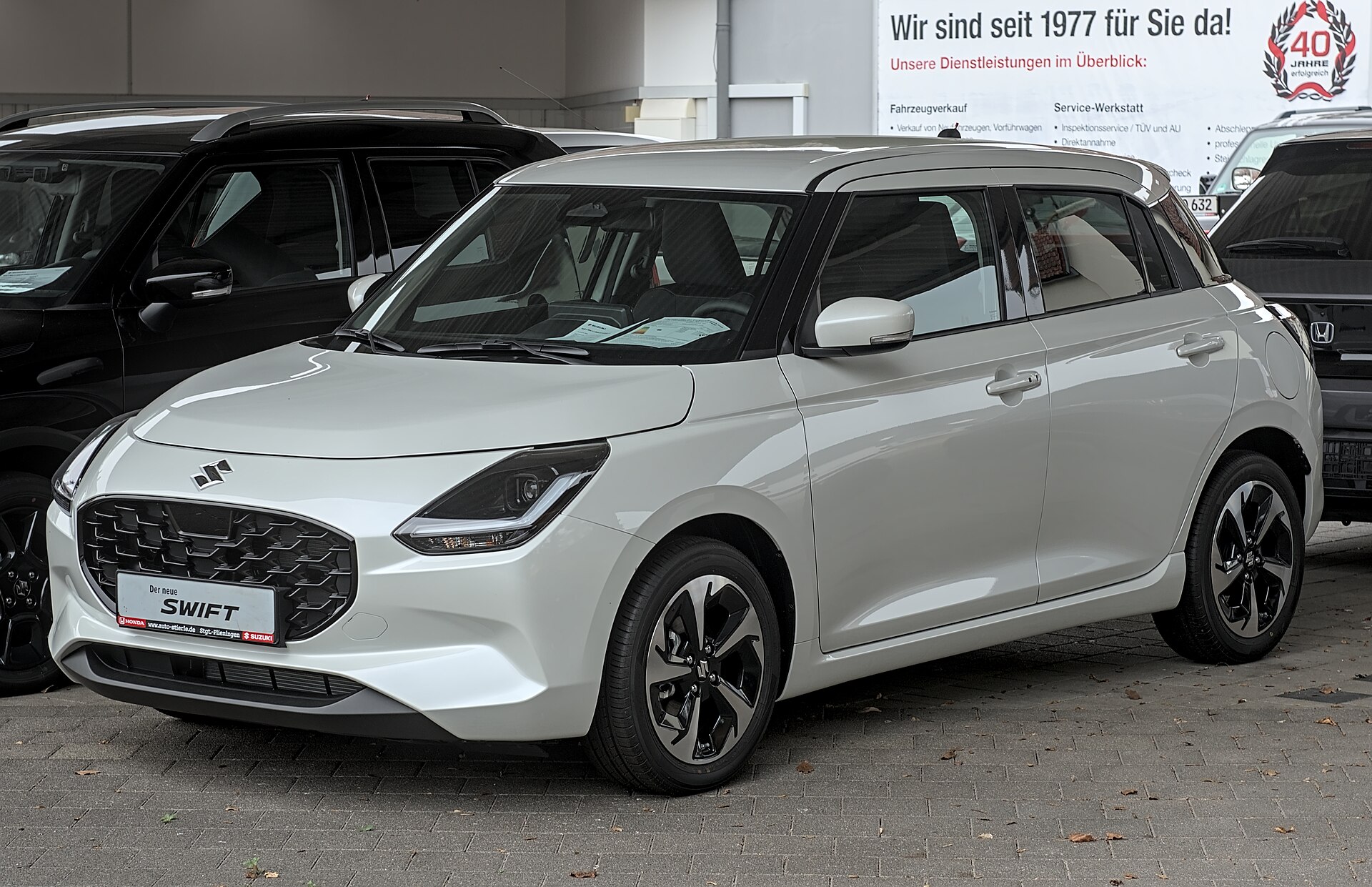 Suzuki Swift official exterior front three-quarter view for export research